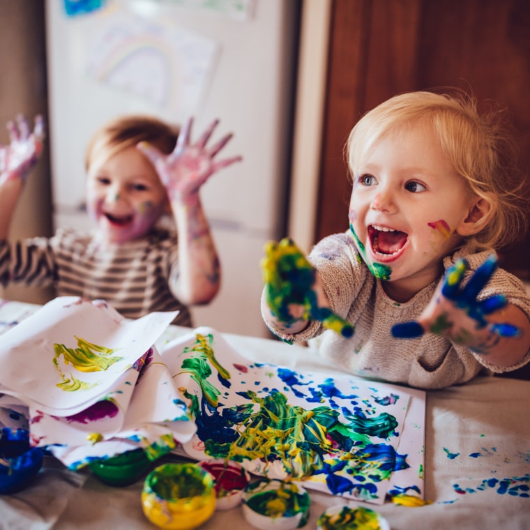 Kids painting at the kitchen table